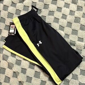 Under Armor loose pants, size youth large, NWT, black with yellow stripe